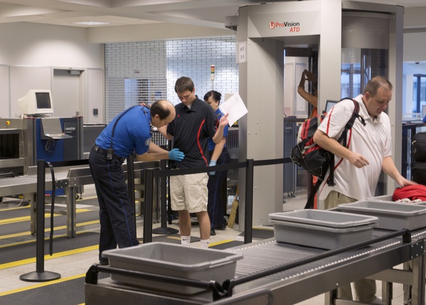 Customer gets screened by airport security