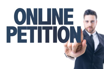 Man clicking on-line petition