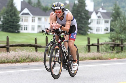 Vlad racing very focused with one person training beside him